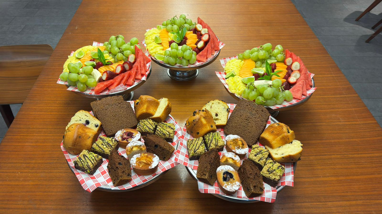 Morning tea spread — fruit, cakes and slices